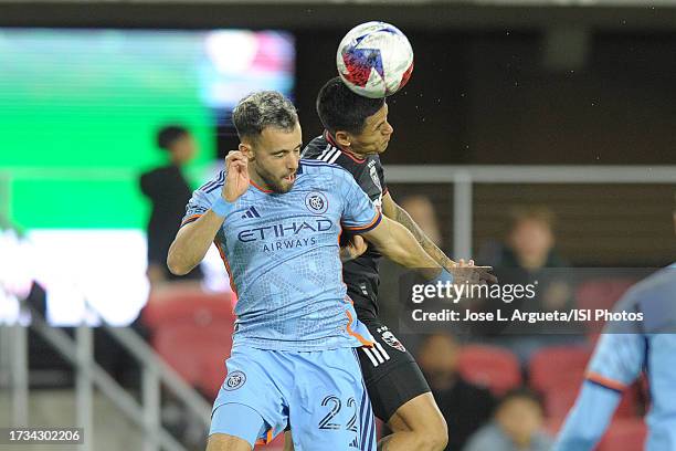 Andy Najar of D.C. United heads the ball against Kevin O'Toole of New York City FC during a game between New York City FC and D.C. United at Audi...