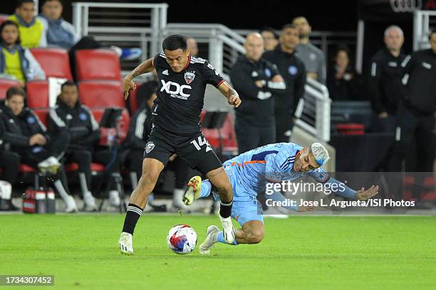 Andy Najar of D.C. United battles for the ball with Santiago Rodriguez of New York City FC during a game between New York City FC and D.C. United at...