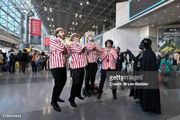 Cosplayer pose as a barbershop quartet and Darth Vader during New York Comic Con 2023 - Day 2 at Javits Center on October 13, 2023 in New York City.