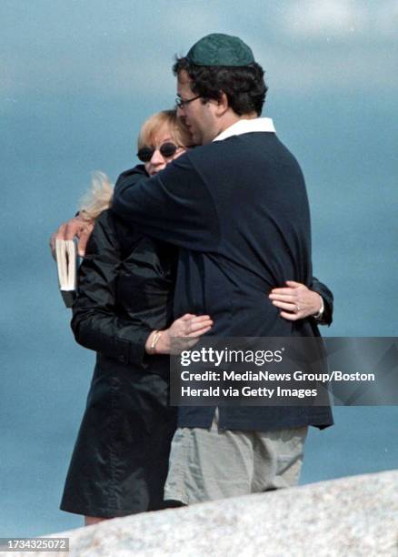 Peggy's Cove, Nova Scotia- Abraham and Cheryl Klein, of Bayside, N.Y. Embrace as they mourn the loss of their father. Staff photo by Arthur Pollock