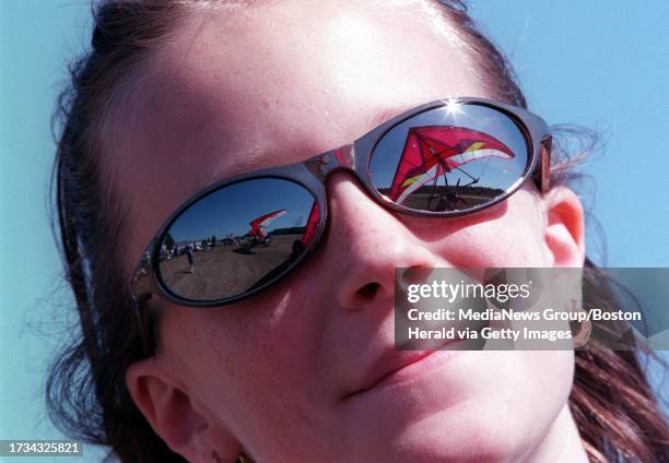 Kerrin Rhuda of Merrimac, MA, watches the activities at the annual ultralight competition day at Plum Island airport. Staff photo by Laurie Swope