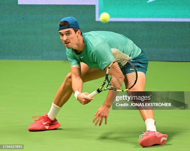 Croatia's Dino Prizmic returns the ball to Sweden's Elias Ymer during their ATP Nordic Open tennis tournament in the Royal Tennis Hall in Stockholm...