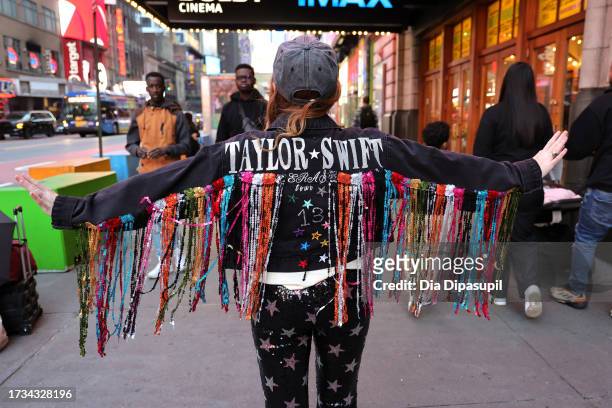 Fan poses before attending the opening night theatrical release of "Taylor Swift: The Eras Tour" concert movie at AMC Empire 25 on October 13, 2023...
