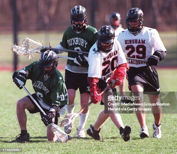 April 7, 1999 Hingham vs Duxbury lacrosse. Hingham's Kevin Foley and Ned Hare try to get the ball from Duxbury's Andy Arnold and Jon Mullins. Staff...