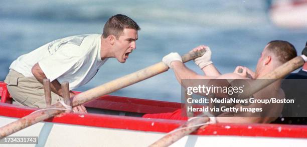 Coxswain Mark Ventimiglia screams out instructions to oarsman Jay Novello as his boat The Pinta races through the harbor in Gloucester.staff...
