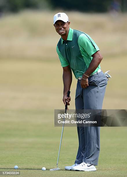 Tiger Woods of the USA hits a shot during a practise day for the 142nd Open Championship at Muirfield on July 14, 2013 in Gullane, Scotland.