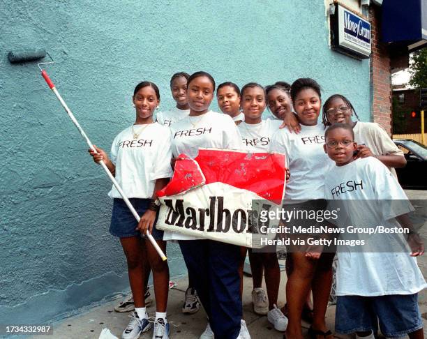 The Boston Area Youth Tobacco Action Group painted the side of Four Brother's Market in Roslindale August 25'99 after ripping the cigarette ads down....