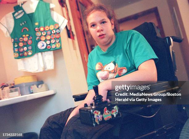 Marika Steir of Atkinson in her home with girl scout vest covered with earned badges. Saved in tues, photo6. Sept. 27. Staff photo by Laurie Swope