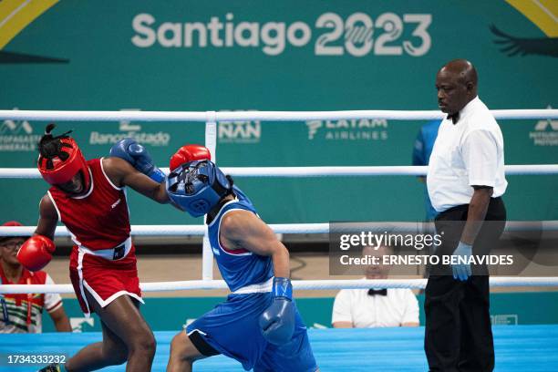 Argentina's Lucia Perez and Guyana's Alesha Jackman compete in the women's 66kg preliminaries - round of 16 of the Pan American Games Santiago 2023,...