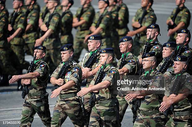 French soldiers parade during the Bastille Day parade on the Champs Elysees on July 14, 2013 in Paris, France. The annual military ceremony is the...
