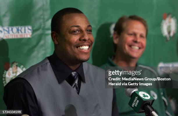 The Boston Celtics announce the singing of Paul Pierce to a 5 year contract.Pierce and Danny Ainge are all smiles at the press conference.
