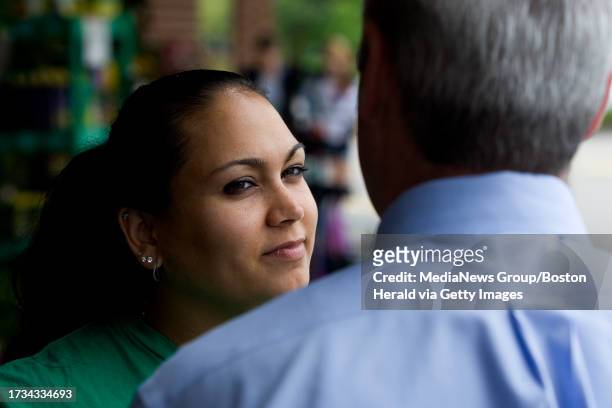 City Councilor Michael Flaherty speaks with Felicia Mohammed, who is an EMT, while campaigning outside of Roche Brothers in West Roxbury, MA on...