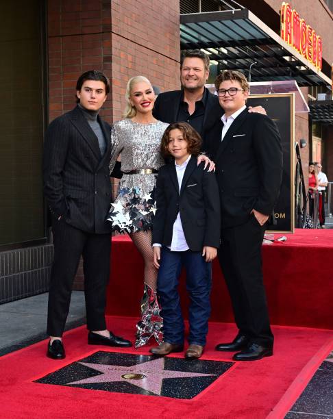 Singer Gwen Stefani with her husband Blake Shelton pose with her sons Kingston, Zuma and Apollo Rossdale on her just-unveiled Hollywood Walk of Fame...