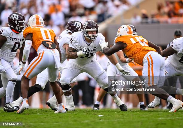 Texas A&M Aggies offensive lineman Chase Bisontis blocks Tennessee Volunteers defensive lineman Tyre West during the college football game between...