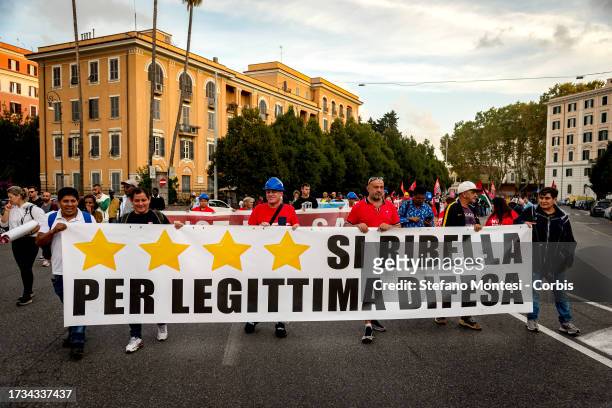 People take part in a demonstration in defense of occupied housing, for the right to housing and a guaranteed income and against the government's...