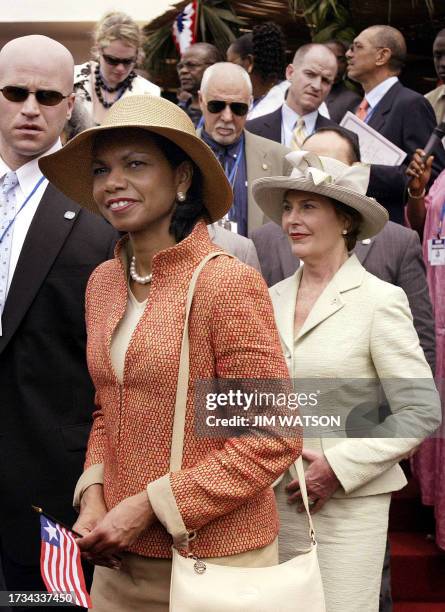 First Lady Laura Bush and US Secretary of State Condoleezza Rice depart after attending Liberia's President Ellen Johnson-Sirleaf swearing-in...