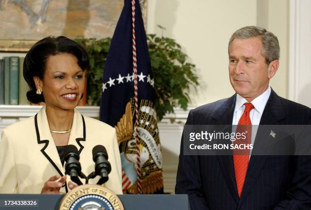 National Security Advisor Condoleezza Rice stands with US President George W. Bush after her nomination to be the next US Secretary of State 16...