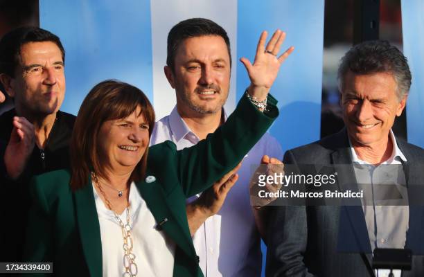 Presidential Candidate for Juntos Por el Cambio Patricia Bullrich waves to supporters alongside Vice Presidential Candidate Luis Petri and former...