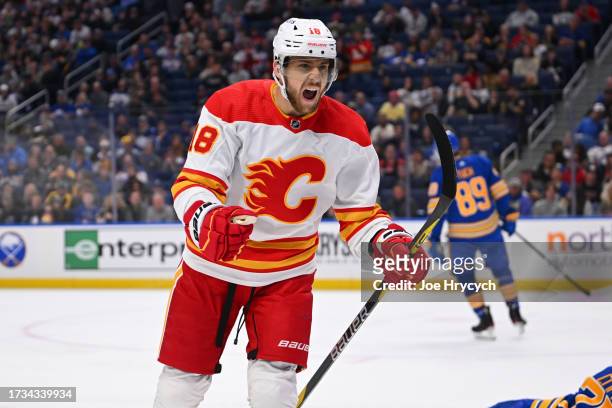 Greer of the Calgary Flames reacts to a goal scored by Walker Duehr during an NHL game against the Buffalo Sabres on October 19, 2023 at KeyBank...