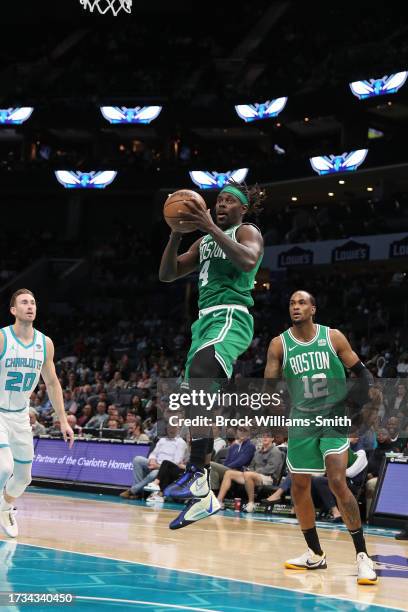 Jrue Holiday of the Boston Celtics drives to the basket during the game against the Charlotte Hornets on October 19, 2023 at Spectrum Center in...