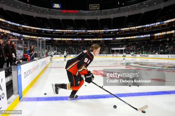 Leo Carlsson of the Anaheim Ducks takes the ice for his first NHL game during warm ups prior to the game the Dallas Stars at Honda Center on October...