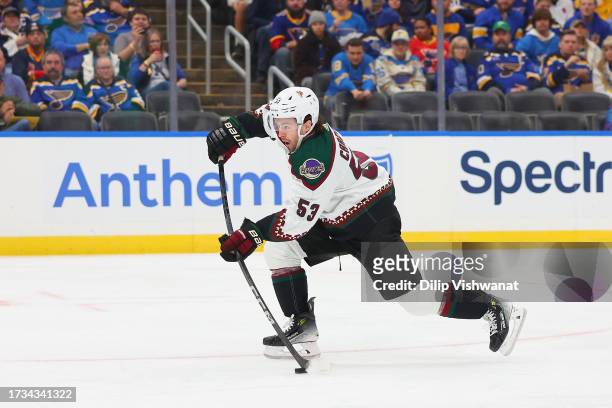 Michael Carcone of the Arizona Coyotes shoots the puck against the St. Louis Blues during the second period at Enterprise Center on October 19, 2023...