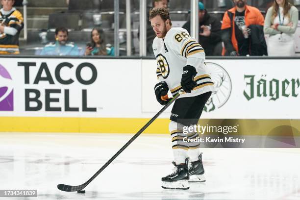 David Pastrnak of the Boston Bruins skates during warmups before the game against the San Jose Sharks at SAP Center on October 19, 2023 in San Jose,...