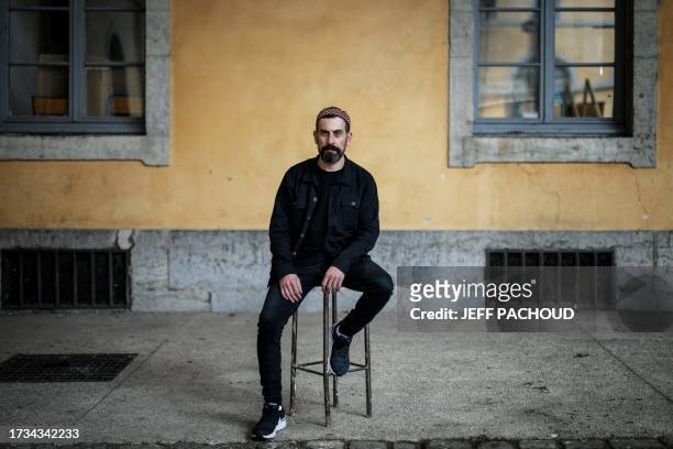 Palestinian comedian Ahmed Tobasi poses around the SUBS theatre where he is performing in the play "And here I am" in Lyon, on October 18, 2023.