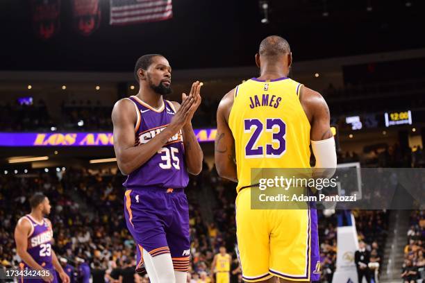 LeBron James of the Los Angeles Lakers and Kevin Durant of the Phoenix Suns talk during the game on October 19, 2023 at the Acrisure Arena in Palm...