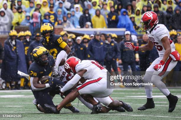 Michigan Wolverines running back Benjamin Hall is tackled by Indiana defenders during a Big Ten Conference college football game between the Indiana...