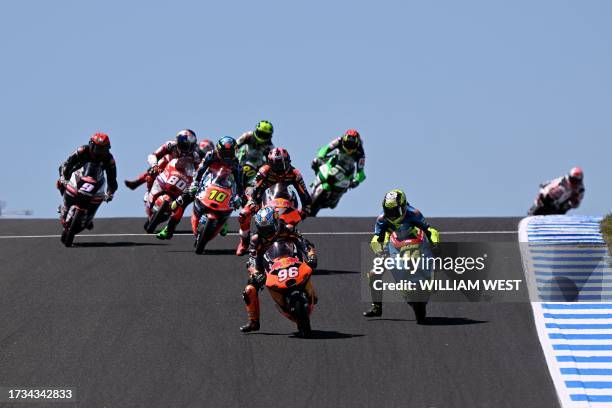 Riders compete during the second Moto3 class free practice session of the MotoGP Australian Grand Prix at Phillip Island on October 20, 2023. / --...