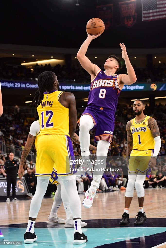 Grayson Allen of the Phoenix Suns drives to the basket during the ...