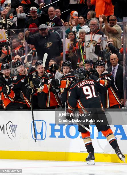 Leo Carlsson of the Anaheim Ducks celebrates first NHL goal during his first NHL game with teammates during the third period against the Dallas Stars...