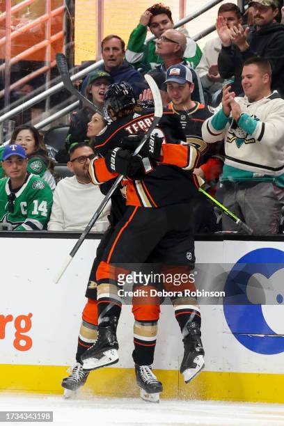 Leo Carlsson of the Anaheim Ducks celebrates first NHL goal during his first NHL game with Troy Terry of the Anaheim Ducks during the third period...