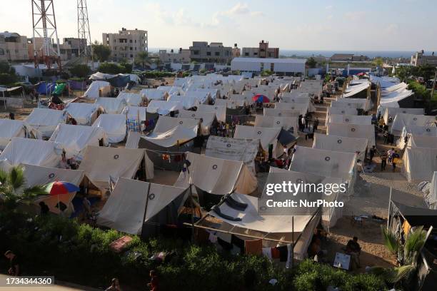 Tents for Palestinians seeking refuge are set up on the grounds of a United Nations Relief and Works Agency for Palestine Refugees centre in Khan...