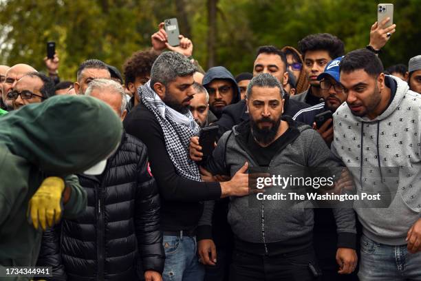 October 16: Oday Al-Fayoumi watches as his 6-year-old Palestinian American Wadea Al-Fayoumi is buried at Parkholm Cemetery on Monday, October 16,...