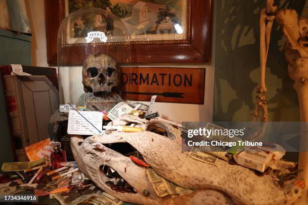 Haunted Mary, a skull at a shop called Woolly Mammoth in Chicago's Andersonville neighborhood. People leave offerings, such as money and cigarettes,...