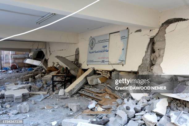 The cracked walls and debris litter the ground a day after the Greek Orthodox Saint Porphyrius Church, the oldest church still in use in Gaza, was...