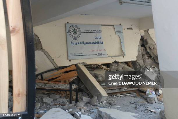Debris and rubble litter the ground a day after the Greek Orthodox Saint Porphyrius Church, the oldest church still in use in Gaza, was damaged in a...