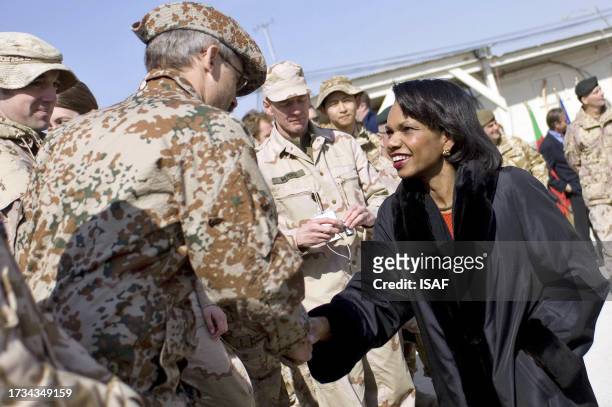 In this image released by the International Security Assistance Force US Secretary of State Condoleezza Rice shakes hands with a soldier of the...