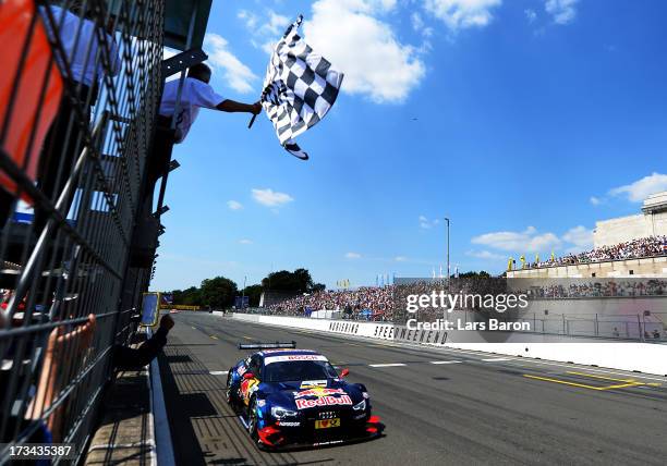 Mattias Ekstroem of Sweden and Audi Sport Team Abt Sportsline crosses the finish line during the fifth round of the DTM 2013 German Touring Car...