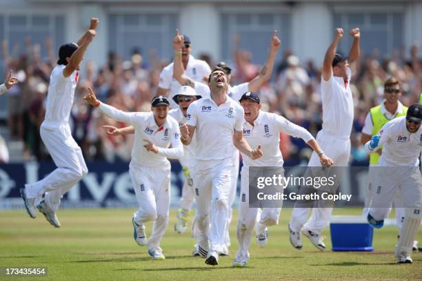 James Anderson of England celebrates the final wicket of Brad Haddin of Australia and victory with team mates during day five of the 1st Investec...