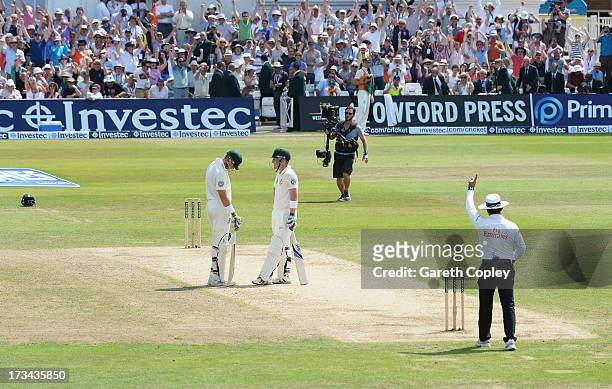 Brad Haddin of Australia is given out by umpire Aleem Dar as he stands with team mate James Pattinson which went to a referral for the final wicket...