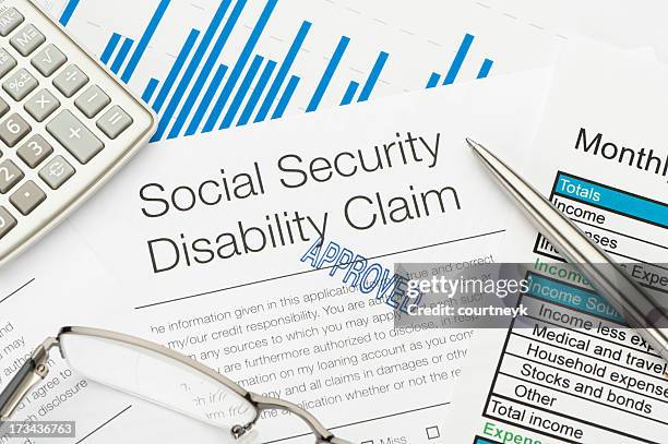 approved social security disability claim form - social security application stock pictures, royalty-free photos & images