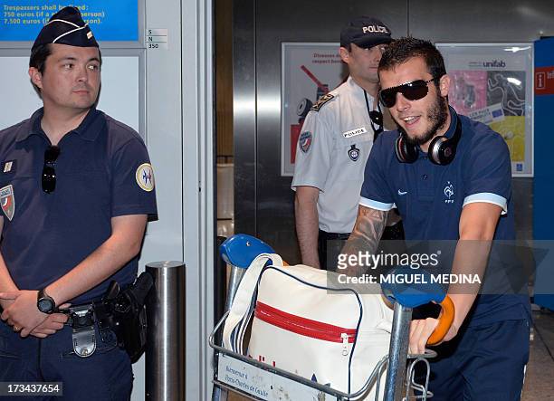 Under-20 French team forward Alexy Bosetti arrives with teammates at the Roissy-Charles-de-Gaulle airport, on July 14 a day after defeating Uruguay...