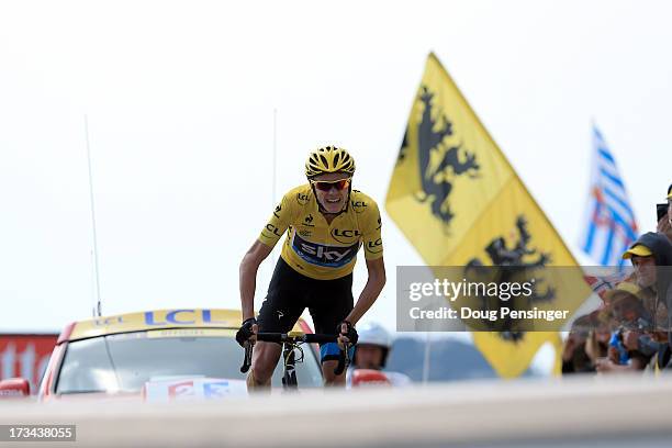 Current race leader and wearer of the Maillot Jaune, Chris Froome of Great Britain and SKY Procycling celebrates winning stage fifteen of the 2013...