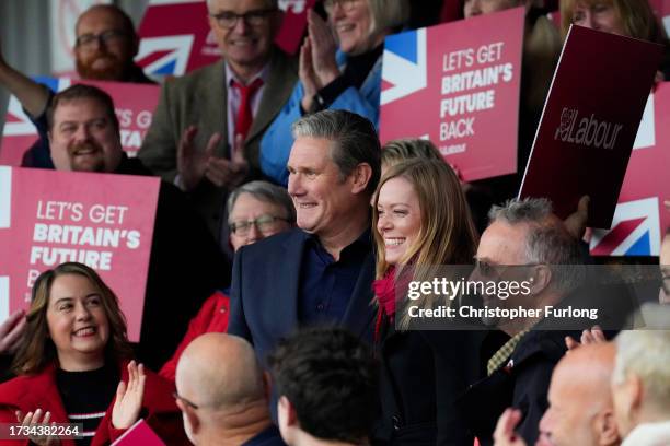 Labour candidate Sarah Edwards smiles as she stands next to Labour Party leader Keir Starmer after winning the Tamworth by-election on October 20,...