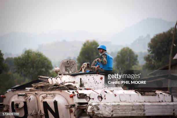 An Indian commander with the United Nations sits atop an armoured personnel carrier in Kanyarucinya on the outskirts of Goma in the east of the...