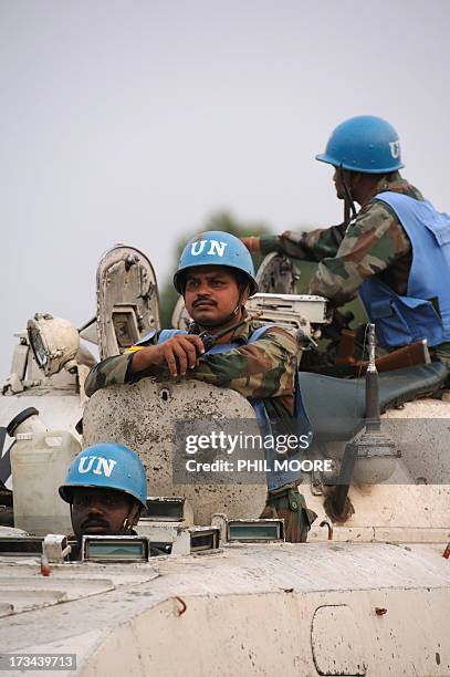 Indian peacekeepers with the United Nations sit atop an armoured personnel carrier in Kanyarucinya on the outskirts of Goma in the east of the...