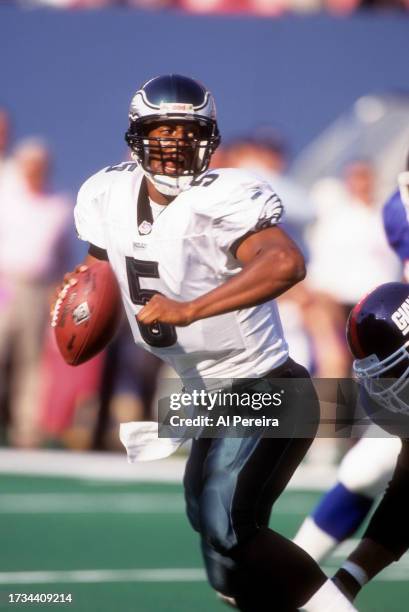 Quarterback Donovan McNabb of the Philadelphia Eagles eludes the rush to pass the ball in the game between the Philadelphia Eagles vs the New York...